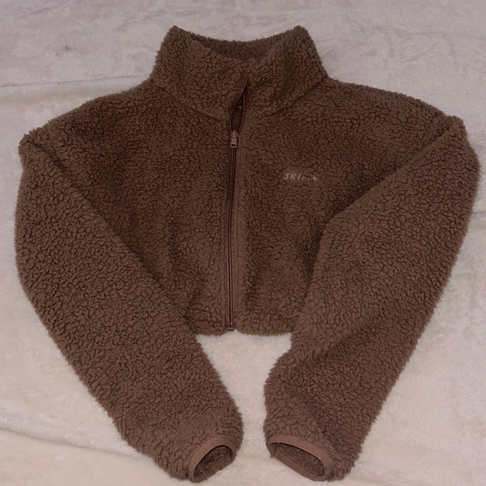 Skims cropped fuzzy zip up jacket